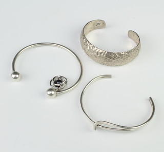 A silver textured bracelet and 2 others, 56 grams