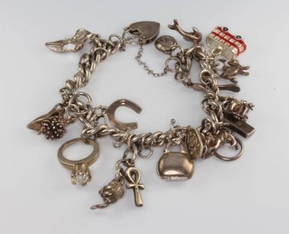 A silver charm bracelet, 61 grams 