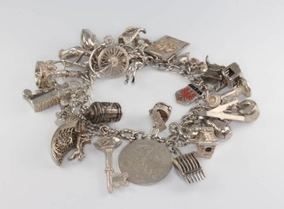A silver charm bracelet 92 grams 
