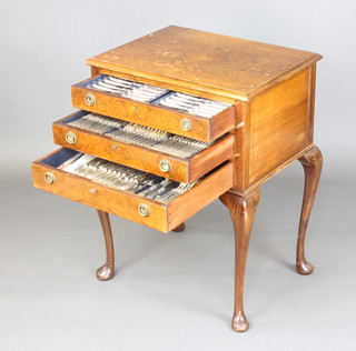 A walnut 3 drawer canteen raised on cabriole legs and pad feet containing a set of Kings pattern cutlery for 12