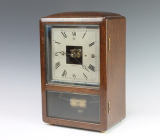 A Bulle patent electric clock, the square silvered dial marked Bulle Patent Pidduck and Sons Ltd Henley, contained in an oak case 