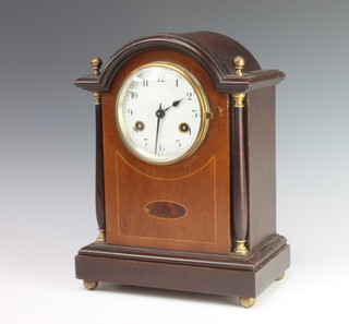 Jungmans, a striking mantel clock having an enamelled dial with Arabic numerals, contained in an inlaid mahogany case