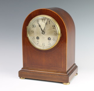Hamburg American Clock Company, a striking mantel clock with silvered dial and Arabic numerals contained in an arch shaped inlaid mahogany case 