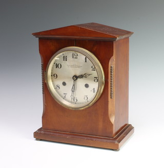 Haller, an Edwardian striking mantel clock with silvered dial and Arabic numerals marked West End Watch Company, contained in a mahogany case raised on bun feet 