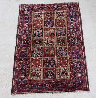 A brown and blue ground Persian Bakhtiari rug, the centre formed of 22 square panels 200cm x 135cm 