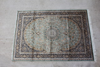 A green ground Belgian cotton Kashan style rug with central medallion within multi row border 230cm x 160cm 