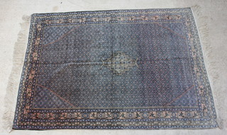 A blue and pink ground Tabriz carpet with central medallion within multi row border 306cm x 218cm 