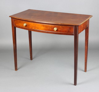 A Georgian mahogany bow front side table fitted a drawer, raised on square tapered supports 74cm h x 91cm w x 50cm d 