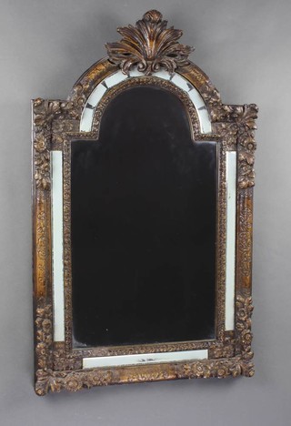A Rococo style arched plate mirror contained in a decorative frame 33cm h x 20cm w 