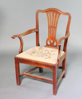 A Georgian fruitwood carver chair with vase shaped slat back and upholstered drop in seat, raised on square tapered supports with H framed stretcher 