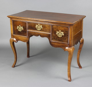 An 18th Century oak low bow fitted 1 long and 2 short drawers, raised on cabriole supports 76cm h x 94cm w x 46cm d 