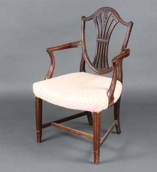 A Georgian mahogany Hepplewhite style open arm chair with over stuffed seats, raised on square tapered supports with H framed stretcher