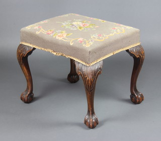 A Georgian style rectangular mahogany stool with Berlin woolwork seat, raised on cabriole, ball and claw supports 47cm h x 55cm w x 45cm d