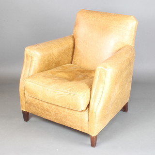A club style armchair upholstered in light coloured leather (slight stain to seat) 