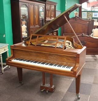 Bluthner, a medium grand piano The Aliquot - Piano - Patent, frame number 114806, contained in a walnut case, raised on 3 tapered supports ending in brass caps and castors 192cm h x 170cm l x 151 cm w