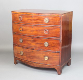 A Georgian mahogany crossbanded bow front chest of 3 long drawers with octagonal brass ring drop handles,  raised on bracket feet 93cm h x 100cm w x 55cm d  