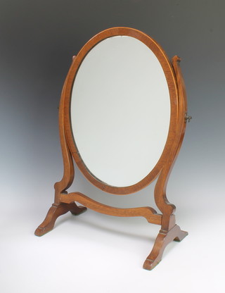 A Georgian style oval plate dressing table mirror contained in an inlaid mahogany swing frame 53cm h x 36cm w x 21cm d 
