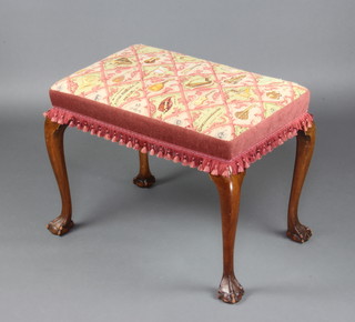 A Queen Anne style rectangular walnut stool with Berlin woolwork seat decorated musical instruments and raised on cabriole ball and claw supports 52cm h x 65cm w x 43cm d  