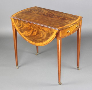 A Georgian oval crossbanded mahogany Pembroke table fitted a drawer raised on square tapered supports ending in brass caps and casters 70cm h x 78cm x 48cm when closed x 100cm when open  