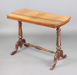 A Victorian mahogany stretcher table raised on turned and reeded supports 67cm x 95cm x 47cm 