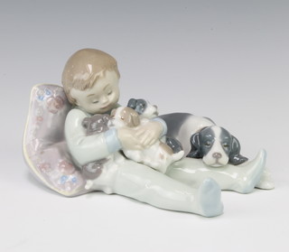 A Lladro group of a child with dog and 3 puppies no.1535 17cm 
