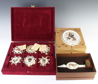 Twenty four Hummel Christmas decorations in a fitted case, a Christmas tree decoration and 3 oval panels 