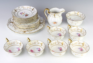 A Spode part tea set comprising 6 tea cups, 6 saucers, milk jug, sugar bowl, 6 small plates, 1 sandwich plate with gilt and floral decoration  