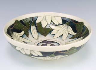 A modern Moorcroft Juneberry pattern bowl decorated with stylised leaves and berries with impressed marks, dated 2000 26cm diam. 