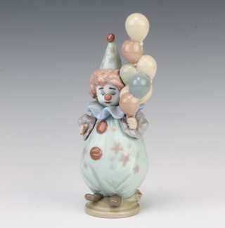 A Lladro figure of a clown holding balloons 5811 18cm 