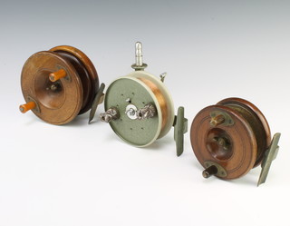A Grace and Young sea fishing reel together with 2 star back fishing reels 14cm and 15cm