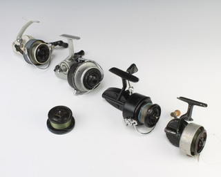 An early Mitchell 300 fishing reel with spare spool, an Alcock Fenton crosswing fishing reel, an Alcock Delmatic reel and a Record threadline reel 