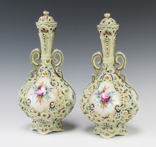 A pair of Edwardian Continental baluster vases with tapered necks decorated with spring flowers, the lids with floral finials 31cm 