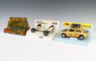 A Dinky Toys model of a 353 Shado 2 Mobile, together with a Polistil Fiat 128 model safari jeep and a Yardley Mclaren M19 model racing car 