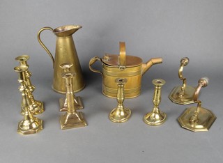 A pair of 19th Century brass Adam style adjustable candlesticks raised on square bases 17cm, a pair of brass candlesticks 23cm, 1 other pair on oval bases 15cm, a brass oval hotwater carrier, a brass jug and 2  brass wall light brackets