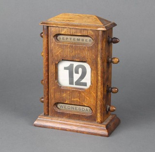 A Victorian perpetual calendar contained in a portico style oak case 20cm x 14cm x 8cm  