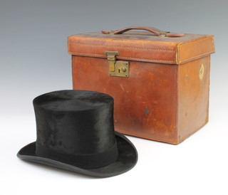 A gentleman's black silk top hat, the interior marked Special Quality, size 7 1/4 complete with carrying case 