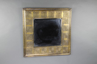 A plate mirror contained in a decorative embossed metal finished frame 60cm x 60cm 
