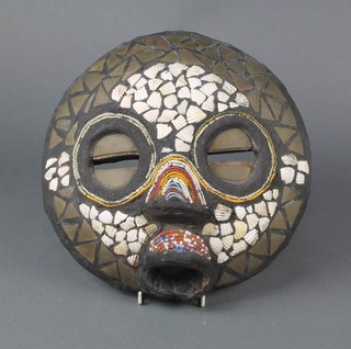 An African carved wooden mask inlaid shells 33cm 
