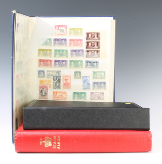A stock book of British Commonwealth stamps George VI - Elizabeth II, a Stanley Gibbons black album of mint and used GB and world stamps George V and later - Cameroon, Australia, India, Italy, New Zealand, South Africa, a red album of world stamps - United States, South Africa, Rhodesia, Kenya, Uganda, British Honduras  