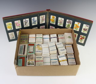 An album of Wills cigarette cards together with a quantity of Players and Wills cigarette cards