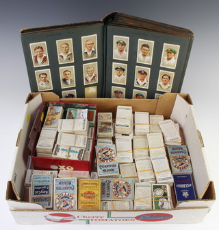 An album of cigarette cards and a collection of loose cigarette cards, Wills, Players etc 