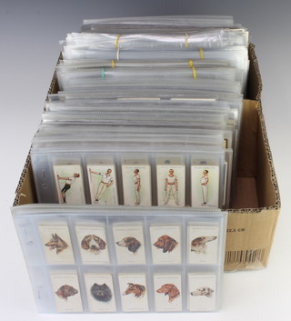 A collection of Players and Wills cigarette cards and sleeves 