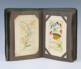An album containing 32 First World War embroidered postcards and other postcards 