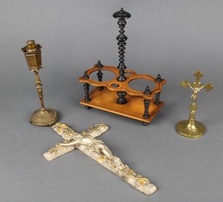A Continental gilt metal crucifix 35cm x 19cm, a brass crucifix on a circular base 14cm x 7cm, a Continental gilt metal table lighter in the form of a street lamp 23cm x 8cm and a Continental wooden 2 bottle cruet stand 26cm x 22cm x 10cm 