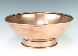 A circular copper bowl raised on a spreading foot 12cm x 35cm diam. 