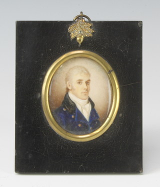 19th Century oval miniature watercolour on ivory of a gentleman wearing a blue frock coat, contained in an ebonised frame with acorn hook 6cm x 5cm 
