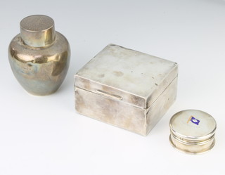 A silver tea caddy of bulbous form London 1920, a do. circular silver box London 1926 and a rectangular silver cigarette box London 1907 