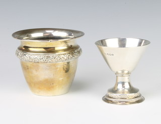 A silver pedestal vase Sheffield 1930 and an Edwardian repousse silver vase Birmingham 1910 165 grams