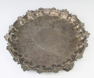 A Victorian silver salver with shell rim and chased floral decoration on scroll feet, London 1841, 1010 grams, 33cm 