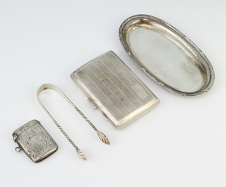 An Edwardian oval silver dish London 1911, a silver cigarette case, vesta and nips 120 grams 